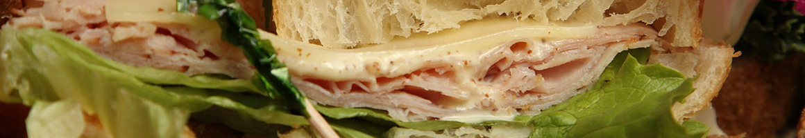 Eating Deli Sandwich at Rupert Jee's Hello Deli restaurant in New York, NY.